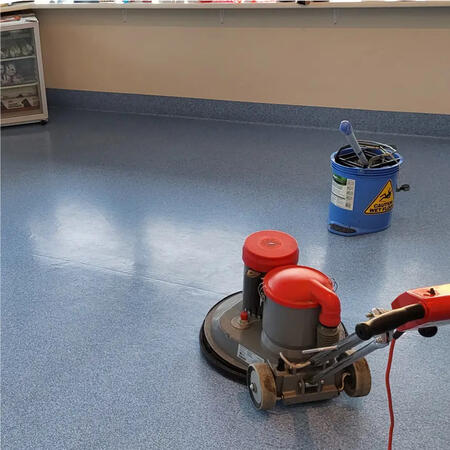 A spotless, polished commercial floor being cleaned with a professional floor scrubber, showcasing the effectiveness of Commercial Floor Cleaning by Platinum Clean Adelaide.